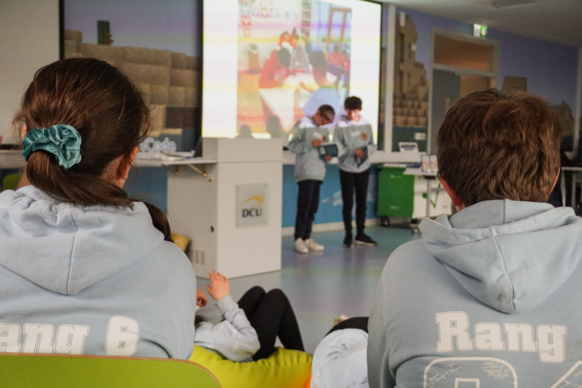 Students reading at 1, 2, Spraoi! book launch