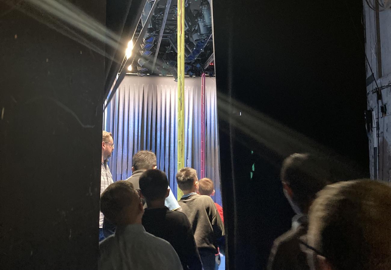 Students walking through backstage of Gate theatre